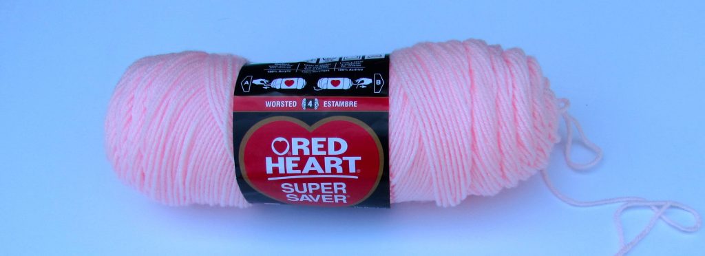 skein of light pink Red Heart acrylic yarn is an example of the best yarn for crochet beginners