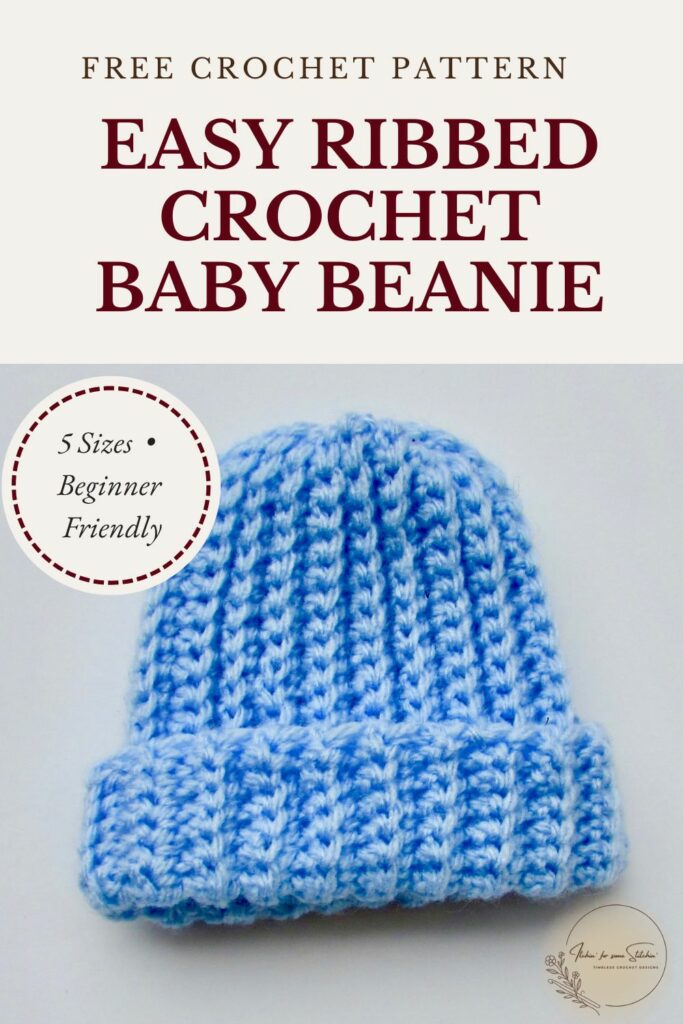Blue ribbed crochet baby beanie with a folded brim for a beginner-friendly pattern available in five sizes.