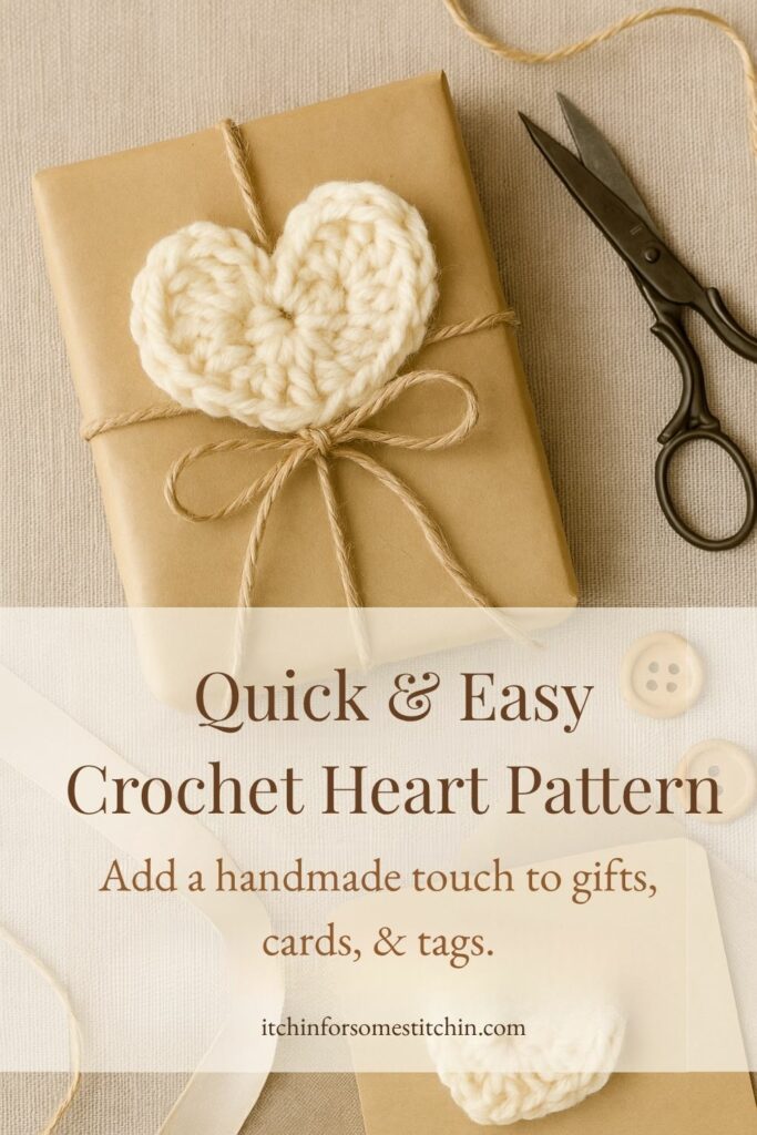 Photo of a crocheted cream heart tied to a kraft paper gift tag with twine, styled with vintage scissors on a soft background. Ideal for gift wrapping, handmade cards, or keepsake projects using a free crochet heart pattern.