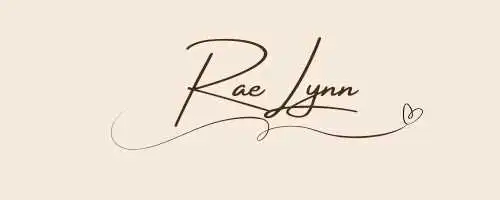 Hand written signature of RaeLynn with a heart in brown ink