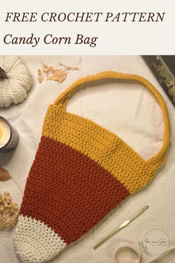 Pinterest graphic for a free crochet candy corn bag pattern, showing a handmade bag with a cream tip, orange center, mustard top, and crocheted handle.