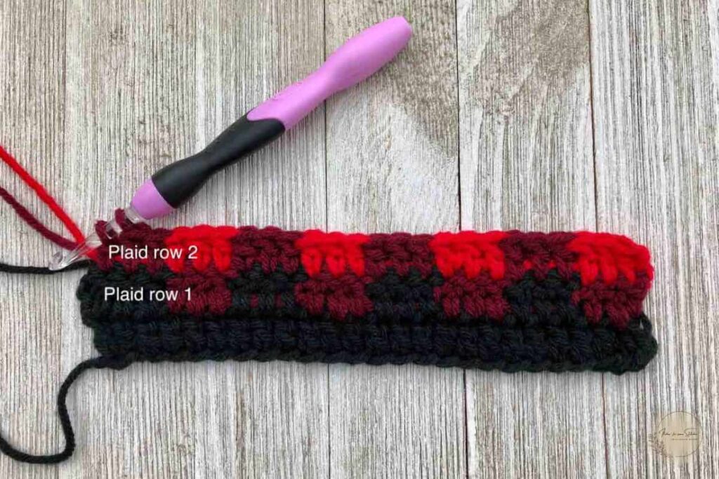 Buffalo Plaid Ear Warmer crochet pattern showing plaid stitch rows 1 and 2 with black, burgundy, and red color placement.