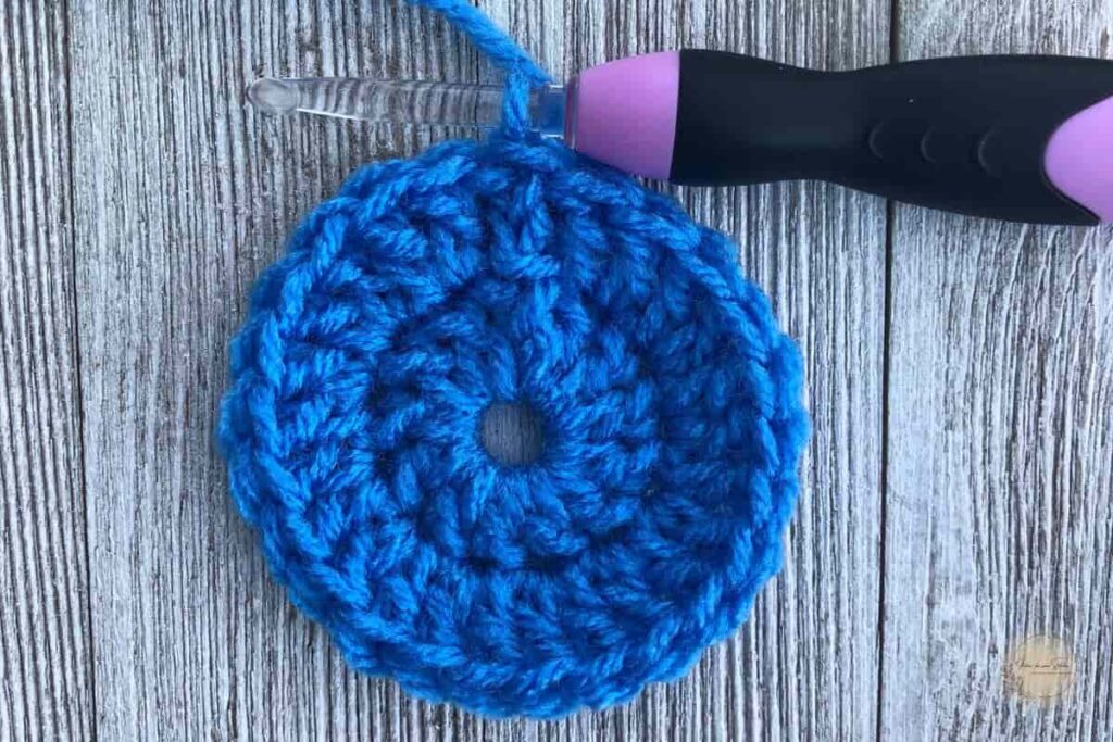 Blue crochet flat circular bottom of the easy crochet easter basket in progress