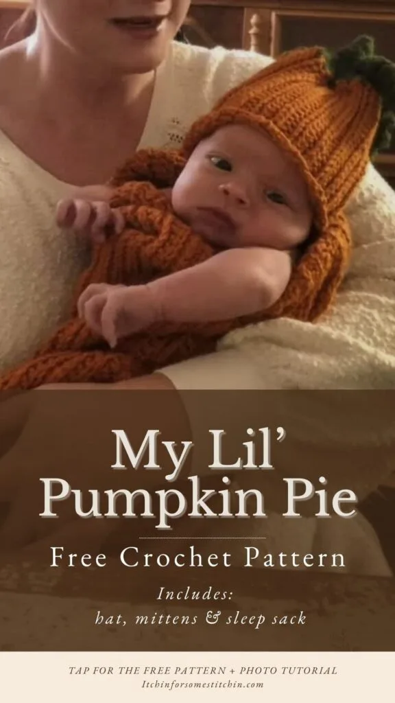 A baby wearing a hand-crocheted pumpkin hat and matching sleep sack, held in someone's arms. Text overlay reads: “My Lil’ Pumpkin Pie – Free Crochet Pattern (Includes: hat, mittens & sleep sack). Tap for the free pattern + photo tutorial – Itchinforsomestitchin.com”