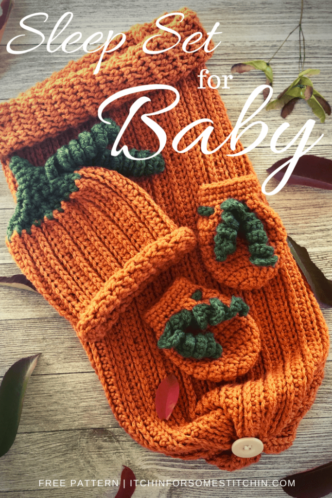 Pumpkin Crochet Baby Sleep Set Pattern with beanie, mittens, and cocoon laid out and surrounded by leaves