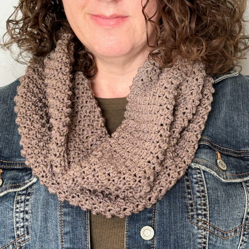 Gray textured crochet cowl with a raised bumpy stitch pattern.