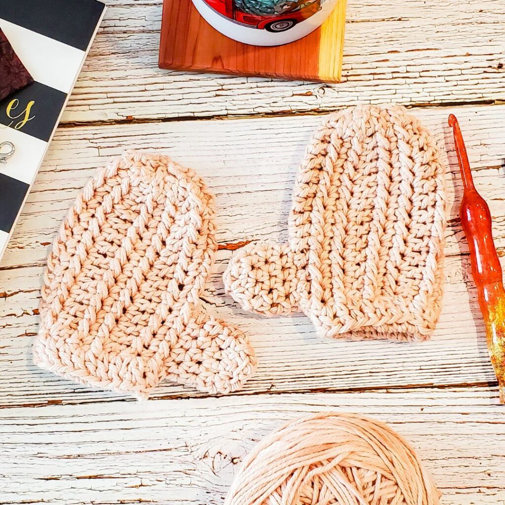Mustard yellow textured crochet mittens with fitted thumbs and folded cuffs.