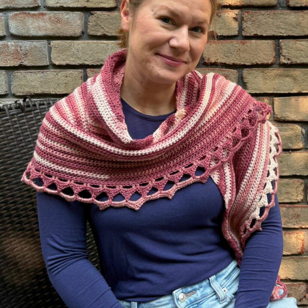 Shaded Elegance crochet shawl in shades of pink with a decorative picot border, designed by The Mother Lode.