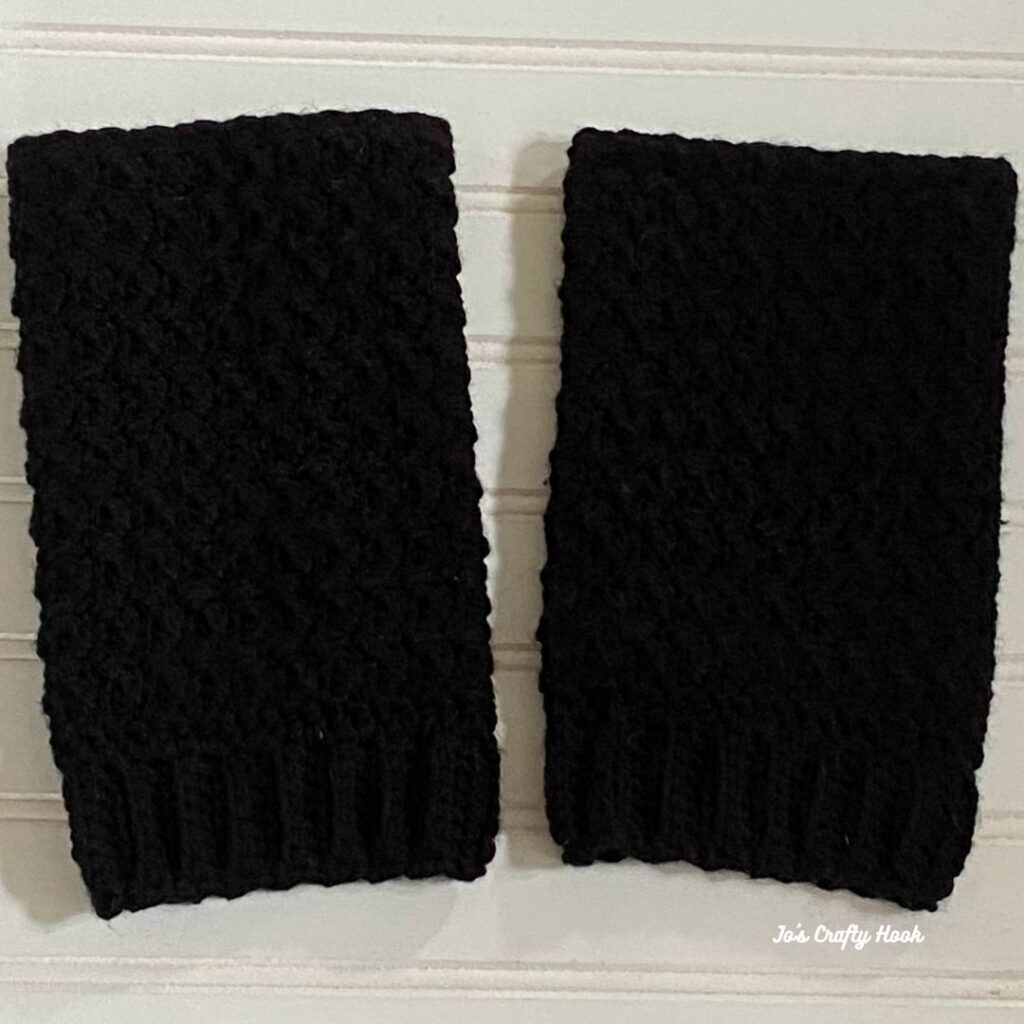 Black textured crochet leg warmers with ribbed cuffs