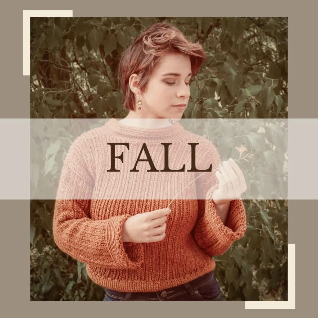 Woman wearing a rust-colored handmade crochet sweater, standing among autumn foliage, representing fall crochet patterns.